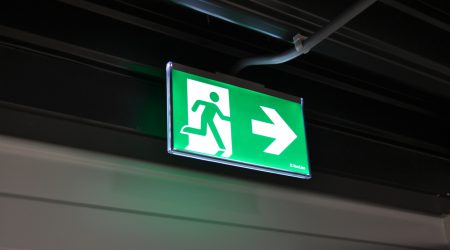 illuminated emergency exit sign above door